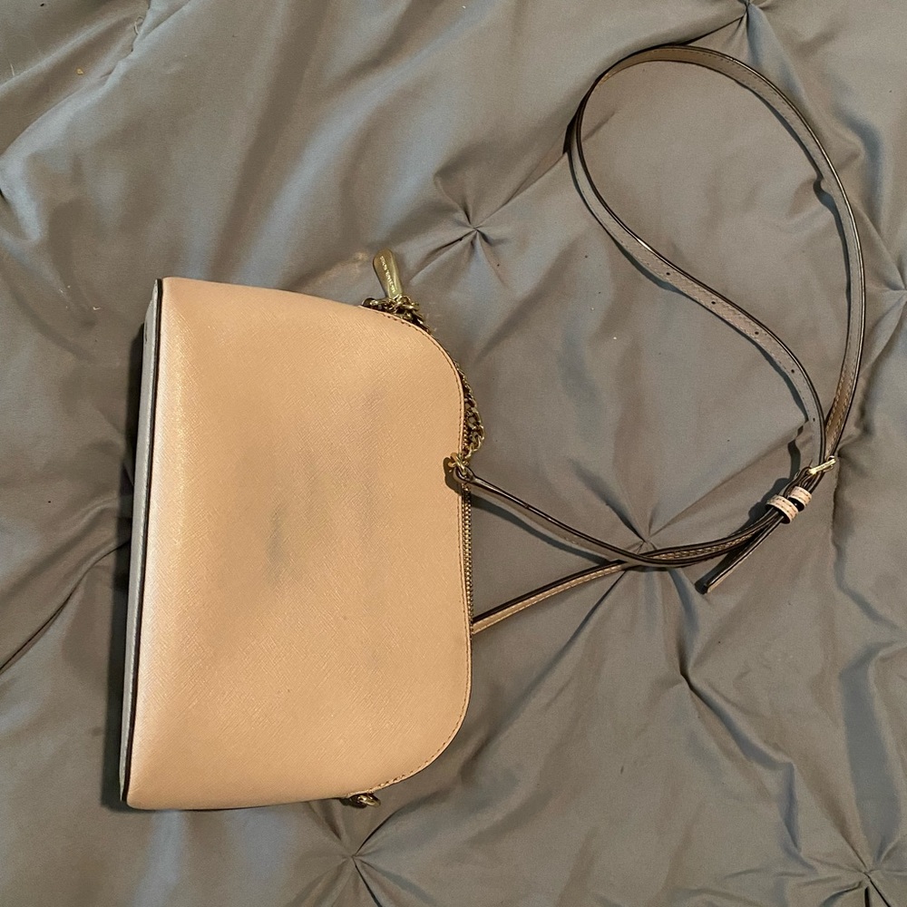 Light pink Michael kors cross body, few marks from where it sat on my jeans